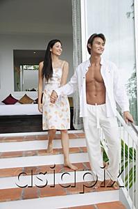 AsiaPix - Couple walking down steps outside of bedroom, holding hands