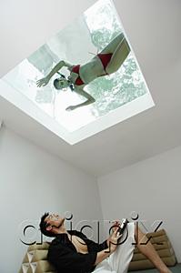 AsiaPix - Man looking at woman in swimming pool through the skylight