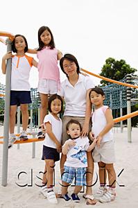 AsiaPix - Siblings at playground, smiling at camera