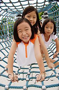 AsiaPix - Girls at playground, crawling through net tunnel