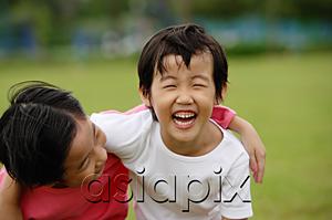 AsiaPix - Two girls with arms around each other, laughing