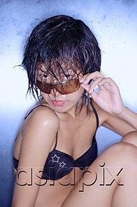 AsiaPix - Young woman in bikini, adjusting glasses