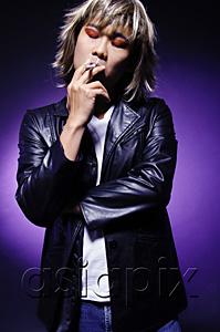 AsiaPix - Man in leather jacket, wearing make-up, smoking