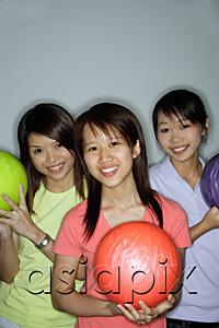 AsiaPix - Three young women with bowling balls, smiling