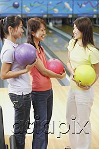 AsiaPix - Women at bowling alley, holding bowling balls
