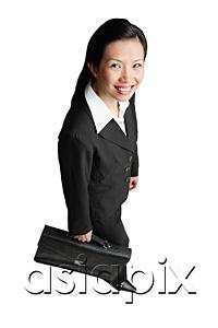 AsiaPix - Businesswoman holding briefcase, smiling at camera