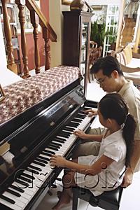 AsiaPix - Father and daughter playing piano
