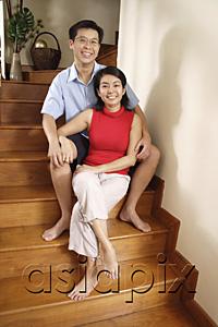 AsiaPix - Couple sitting on stairs, smiling at camera