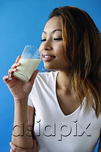 AsiaPix - Woman drinking a glass of milk