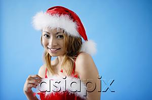 AsiaPix - Woman in Santa hat and red dress