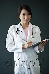 AsiaPix - Female doctor standing with clipboard