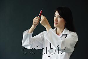 AsiaPix - Female doctor preparing syringe