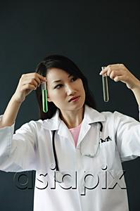 AsiaPix - Doctor looking at two test tubes