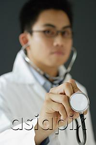 AsiaPix - Doctor listening to stethoscope