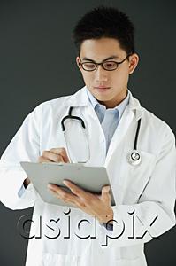 AsiaPix - Doctor writing on clipboard