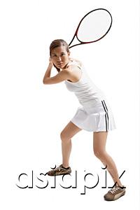 AsiaPix - Young woman holding tennis racket, waiting for ball