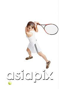 AsiaPix - Young woman holding tennis racket, waiting for ball