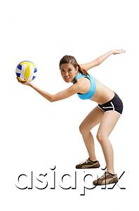 AsiaPix - Young woman preparing to hit volleyball