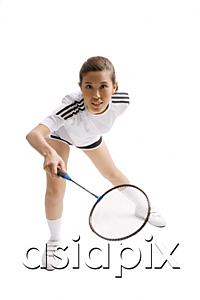 AsiaPix - Young woman playing badminton, studio shot