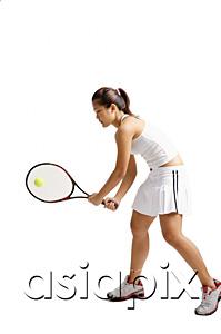 AsiaPix - Young woman playing tennis, studio shot