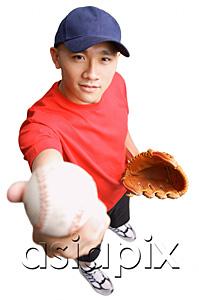 AsiaPix - Young man wearing baseball glove and holding ball out to camera