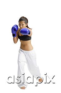 AsiaPix - Female boxer, wearing boxing gloves, facing camera