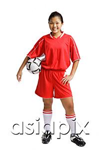 AsiaPix - Young woman in soccer uniform, carrying soccer ball under arm