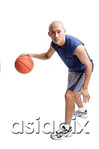 AsiaPix - Young man dribbling basketball