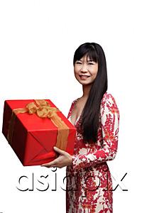 AsiaPix - Woman with long straight hair, holding gift wrapped box