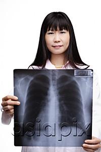 AsiaPix - Doctor holding X-ray, looking at camera
