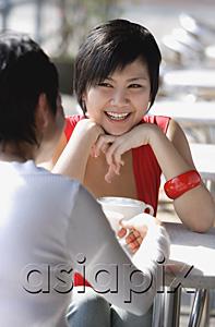 AsiaPix - Two women in cafe, over the shoulder view