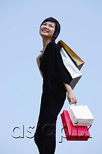 AsiaPix - Woman carrying shopping bags