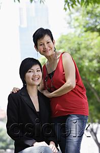 AsiaPix - Mother and adult daughter looking at camera