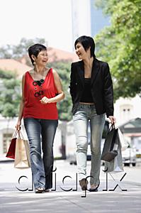AsiaPix - Mother and adult daughter walking in city, carrying shopping bags