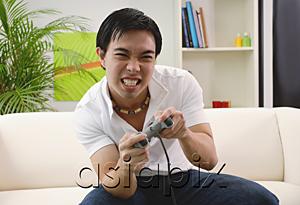 AsiaPix - Man playing with video game