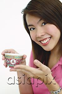 AsiaPix - Woman holding Chinese tea cup