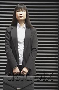 AsiaPix - Businesswoman with briefcase, serious expression