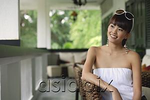 AsiaPix - Young woman in white tube top, looking away