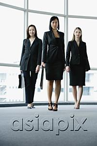 AsiaPix - Three businesswomen, walking towards camera
