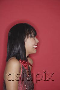 AsiaPix - Woman with bob haircut, smiling, side view