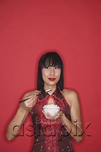 AsiaPix - Woman dressed in red, holding bowl of rice