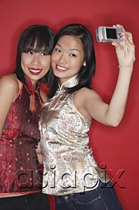 AsiaPix - Two women taking a picture of themselves