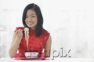AsiaPix - Woman eating bowl of noodles