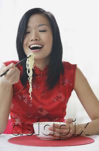 AsiaPix - Woman eating noodles