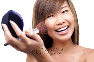 AsiaPix - Teenage girl applying make-up