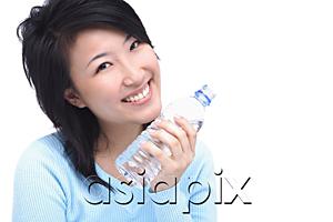 AsiaPix - Young woman with bottle of water, smiling