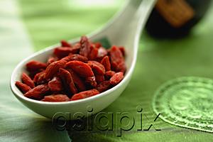 AsiaPix - Close-up of dried fruit in ceramic spoon