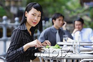 AsiaPix - Business people at outdoor cafÃ©, focus on woman in foreground, looking at camera