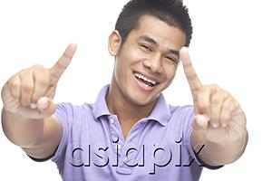 AsiaPix - Man smiling, making hand sign