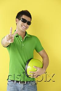 AsiaPix - Man wearing sunglasses, making peace sign